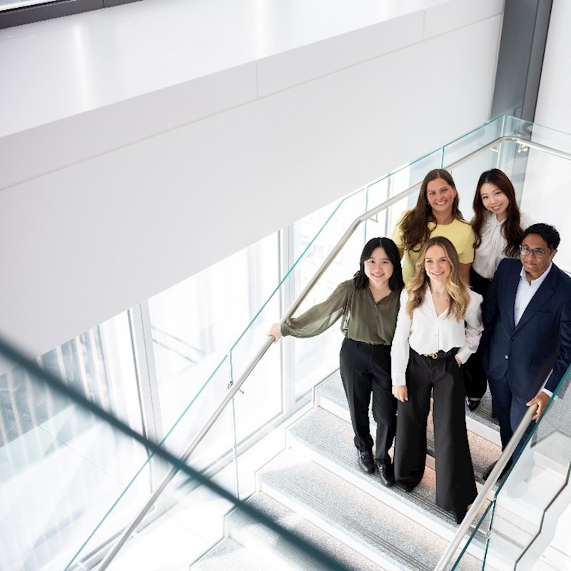 group of trainees standing on the steps